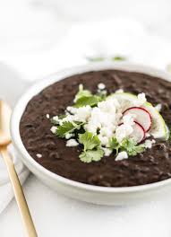 Place onion, garlic, canned beans and 1/2 tablespoon of reserved bacon grease in a blender. The Easiest Refried Black Beans Recipe