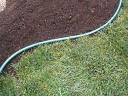 Spray with a water hose to set the sand. How To Add A Border To A Garden How Tos Diy