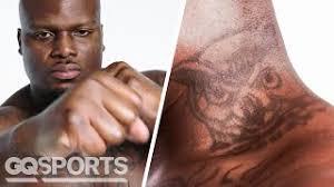 UFC Fighter Derrick Lewis Breaks Down His Tattoos