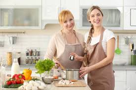 Use a food thermometer to check the internal temperature. Young Woman And Her Mother Cooking In Kitchen Stock Photo Picture And Royalty Free Image Image 98039314