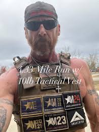 Intense CrossFit-style workout with tactical vest and barbell