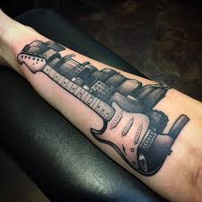 Maybe you would like to learn more about one of these? Tattoos By Brad Dozier Made This Cool Little Guitar And Nashville Skyline