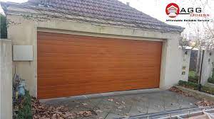 last week s b d panel lift installation australian cedar colour seville style if you would be int wooden garage doors garage doors for sale wooden garage
