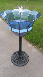 Bird Bath And Feeder With Solar Light I Repurposed A Old Light Fixture By Taking Out All The Wires Mounted It On A Bird Bath Stand And Bolted A Solar Lig Bird Bath Concrete Bird Bath Diy Bird
