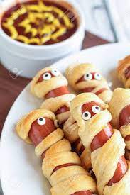 Fun Food For Kids Mummy Hot Dogs Lying On A Rustic Table With Stock Photo Picture And Royalty Free Image Image 129389086