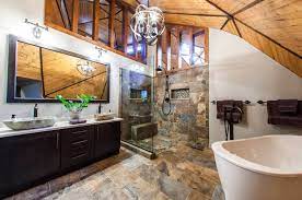 The pristine white tub, sink, and medicine cabinet really pop against the ridged ceiling, stone walls, and wood floors. 90 Rustic Primary Bathroom Ideas Photos Home Stratosphere