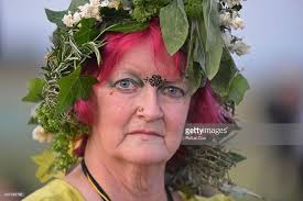 A druid pose for a photo while taking part in celebrations to mark...