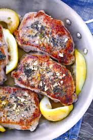 The bones add more flavor, and the meat is more moist. Juicy Oven Baked Pork Chops With Garlic And Herbs Bowl Of Delicious