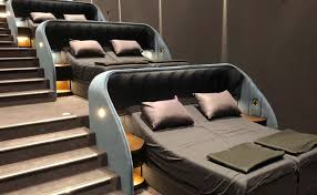 This Movie Theater Lets You Watch Movies While Relaxing In Double Beds In 2020 Bed Cinema Double Beds Bed