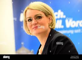 Augsburg, Germany. 13th Mar, 2019. Eva Weber (CSU), mayor of Augsburg,  stands in front of a poster in the town hall. She is the CSU's designated  candidate for the 2020 local elections.