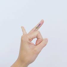 Lavender Tattoo On The Left Ring Finger Lavender Tattoo Finger Tattoos Flower Finger Tattoos