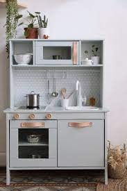 ikea kitchen in mint green with leather drawer pulls and hexagonal backsplash image from hello hello cuisinette ikea cuisine en bois enfant cuisine ikea