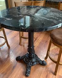 It's crafted from solid wood, with either an oak or walnut wood grain tone, and has a rounded surface set on four oval legs. J24 Cast Iron Table Base Custom Granite Table Top Https Tablebases Com Blog