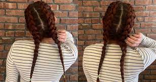 Now that your hair is in two portions evenly, tie up one side with a binder. How To Dutch Braid Your Own Hair L Oreal Paris