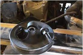 Locate the power steering pump and the mounting bracket that secures it in position. How To Remove A Gm Or Chevy Power Steering Pump Pulley The Easiest Way Backyardmechanic