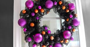 For halloween, give your doors a spooky vibe with this mesh wreath project embellished with tokens perfect for the occasion. Spooky Diy Wreath For Halloween Dollar Tree