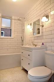 White Extra Long Subway Tile Sleek Clean Modern Bathroom Apartment For Rent In Montreal Modern Bathroom Tile Modern Bathroom Small Bathroom Decor