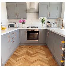 White cabinetry is frequently used in small galley kitchens because it reflects light and brightens a compact space. Fairford Slate Grey Kitchen White And Grey Kitchen Design Whiteandgreykitchendesign In 2021 Small Modern Kitchens Kitchen Remodel Small Kitchen Design Small