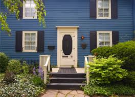 A dark blue exterior paired with the warm glow of lights inside makes the perfect setting to come home to. The 10 Best Accent Colors For Your Home Exterior Bob Vila
