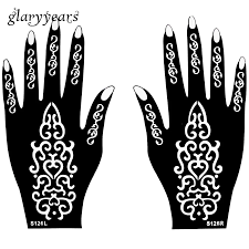 The dark chocolate henna tattoo with the red and orange gems for a woman. Hot 1 Pair Henna Tattoo Stencil Gorgeous Flower Picture Design Hands Mehndi Artistic Airbrush Painting Tattoo Template Gift S126 Tattoo Design Templates Tattoo Templatetattoo Stencil Aliexpress