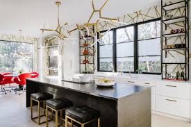 The great white and gray kitchen to accentuate flowy and creamy whites in a big space with a lot of light, one needs to strategically undertone it with darker hues. A Chic Modern Kitchen In Black White And Brass