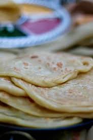They are rolled either plain, or folded over twice, or thinly stretched, gathered into a coil and. Roti Canai Traditional Southeast Asian Flat Bread 196 Flavors