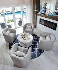Lovely Living Room Featuring Sally Swivel Chairs And A Trevor Ottoman Small Sitting Rooms Swivel Chair Living Room Living Room Furniture Arrangement