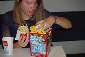 Friends with babies enjoying meal. Is Mcdonald S Happy Meal Now Happier Food Republic