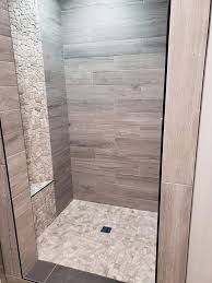 It allows you to enjoy the aesthetics of traditional wooden floors without all the worries of maintenance and associated costs. Wood Look Tile Shower With Mdg Contracting Design Llc Facebook