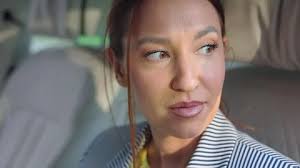 beautiful girl in expensive business suit in luxury expensive car with  white lea