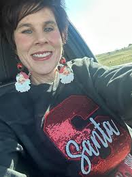 Santa sweatshirt and earrings match perfectly