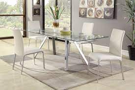 It boasts two manually adjustable extensions that pull from each end on durable and quiet nylon glides. Featuring Two Self Storing Extensions This Tempered Glass Table Adds Style And Additional Seati Dining Sets Modern Contemporary Dining Sets 5 Piece Dining Set