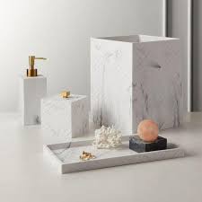 Handcrafted to exhibit the beautiful veining of the natural white marble, these frost marble accessories elevate the bath to spa status. Santi White Marbleized Tiles Bath Accessories