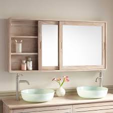 A pair of shaded sconces complete the look and provide plenty of ambient bathroom lighting. Bathroom Mirror With Storage Behind Trendecors