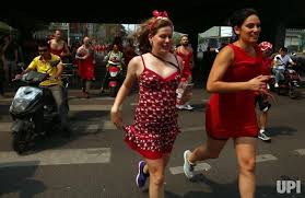 Both Chinese And Foreign Men And Women Wearing Red Dresses Run Through The Streets Of Beijing During The Hash Red Dress Wear Red Dress Red Dress Run Red Dress