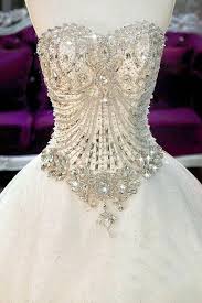 Provocativeness and sensuality are personified into a dress with this spectacular mermaid design, with jewelled bodice and illusion transparencies that blend crystal tulle and gemstones into the skin as if it were a tattoo. Jewel Encrusted Wedding Corset Ball Gowns Wedding Dream Wedding Dresses Wedding Dresses