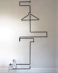 Xy Z Suit Rack By Emma Fox Derwin Nigel Groom The Piece Folds Up For Easy Assembly Disassembly An Valet Stand Modern Office Interior Design Clothes Stand