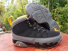 Taking a more subtle approach to the air jordan 9, this rendition pairs subdued tones of black and charcoal on genuine nubuck leather with pops of university gold throughout the sockliner and branding on the midsole, tongue and heel. Air Jordan 9 Black Dark Charcoal University Gold For Sale Hoop Jordan
