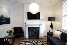 8 Ways To Lighten Up A Dark And Gloomy Space Dark Living Rooms Black And White Living Room Living Room Light Fixtures