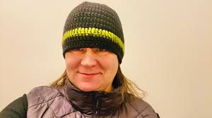 Crocheting micro hats for donation