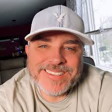 Gibson cat relaxing with iPod games