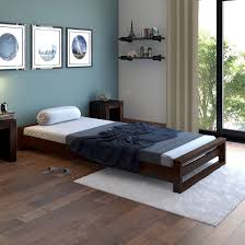 Wooden bed frames are classic, strong and look great in almost every bedroom due to their natural aesthetic. Single Bed Buy Single Beds Online Latest Single Bed Designs Urban Ladder