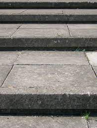 How To Install Laminate Flooring Over Concrete Slab Hunker Concrete Porch Concrete Patio Makeover Concrete Slab