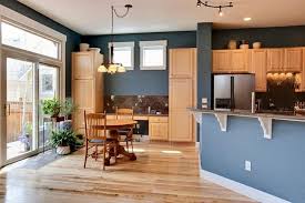 honey oak cabinets, blue kitchen walls