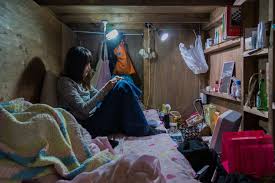 Light wood chairs with grey upholstery and a wooden windowsill bench. Shocking Pics Of People Living In Incredibly Tiny Rooms In Japan Bored Panda