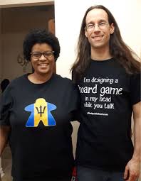 Joe Slack and his wife Lisa wearing proudly wearing their Geeky Goodies.  Joe is always designing a board game in his head and you can find out more  about him and his