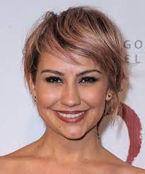 Chelsea is wearing a floral print tube top dress with side pockets and a gold necklace with a tiny charm. 17 Chelsea Kane Hairstyles Hair Cuts And Colors