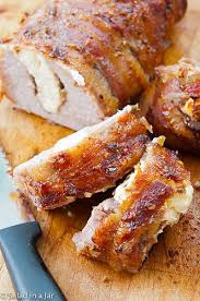 Bacon Wrapped Stuffed Pork Tenderloin With Raspberry Chipotle Sauce Recipe Stuffed Pork Tenderloin Recipes Raspberry Chipotle Sauce