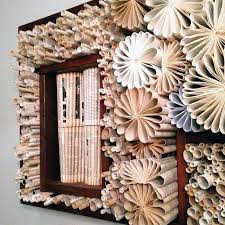 Hang This Old Book Idea On Your Wall And Your Guests Won T Be Able To Take Their Eyes Off It Pounded Flowers Fun Decor Old Books
