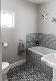 Dark red with light grey moroccan hand painted tile. Grey Bathroom Metro Tiles Star Shaped Mirrors Moroccan Floor Tiles And Moroccan Style Hand Towel Farrow Banheiro Cinza Banheiro Inspiracao Para Banheiro